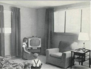 Louise McCready adjusts TV while brother Mike, ignoring the camera, waits patiently for the picture to come on the screen.